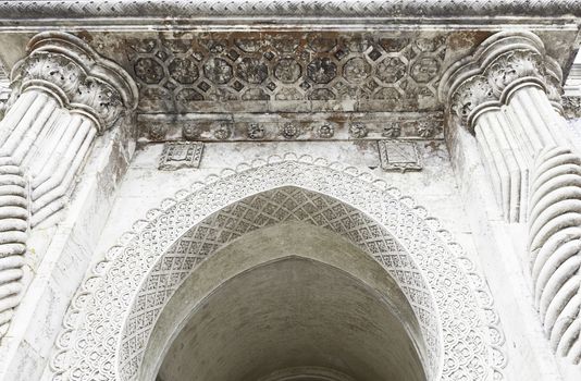 Stone arch decorated, detail of a wall decorated in stone, ancient art