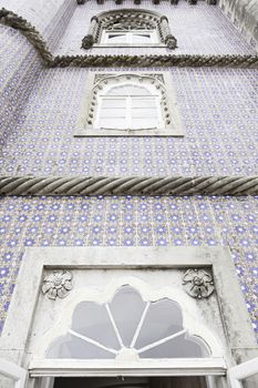 Old facade with typical tiles from Lisbon, detail of a decorated wall, typical architecture of Portugal