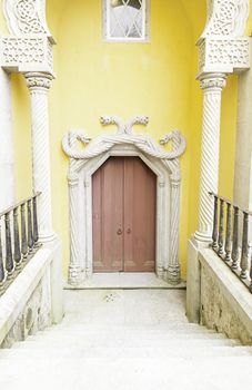 Old door decorated in Sintra, detail of decoration in a castle in Portugal, Manueline arches decorated