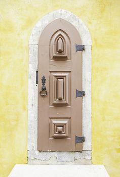 Old wooden door in Sintra, detail of a palace in a decorated door Portugal, architecture, tourism