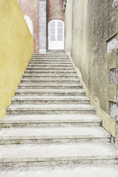 Old stone stairs in the town of Sintra, detail of a stairs to a house in Portugal