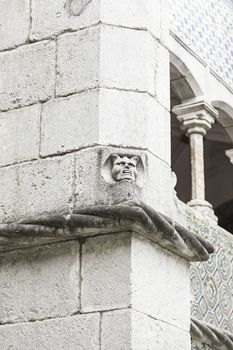 Gargoyle in Sintra Pena Palace, detail of an old heritage of humanity building, tourism in Portugal