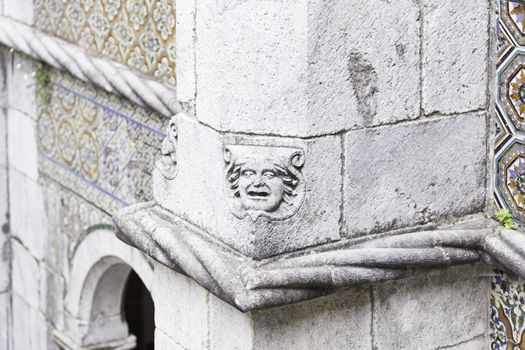 Gargoyle in Sintra Pena Palace, detail of an old heritage of humanity building, tourism in Portugal