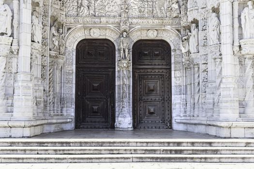 Facade of Jeronimos in Lisbon, detail of old building in Portugal, Manueline architecture