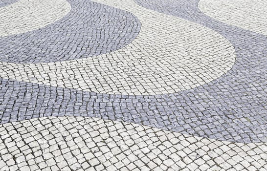Typical stone floor Lisbon, detail of a typical floor with shapes and drawings, art Portugal, tourism