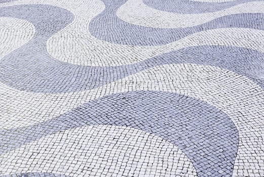 Typical stone floor Lisbon, detail of a typical floor with shapes and drawings, art Portugal, tourism