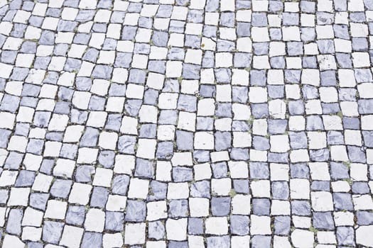 Typical stone floor Lisbon, detail of a typical floor with shapes and drawings, art Portugal, tourism