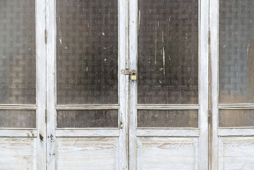 Old wooden windows, a detail windows closed and abandoned, ruin and abandonment