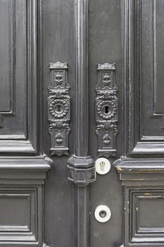 Old door decorated, detail of a typical Lisbon door, security protection and decoration