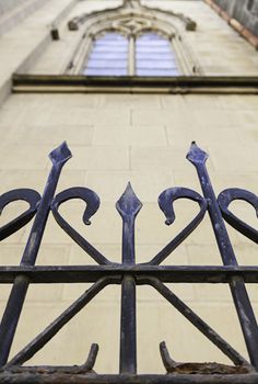 Metal railing on a church, detail of a metal shield on a facade, art and Safety