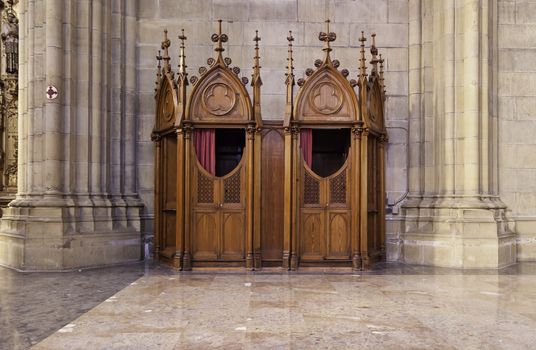 Confessional in a Catholic church, a Romanesque church detail inside