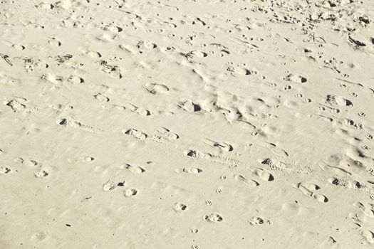 Footprint in the sand on the beach, detail signal marked in the sand, sea sand