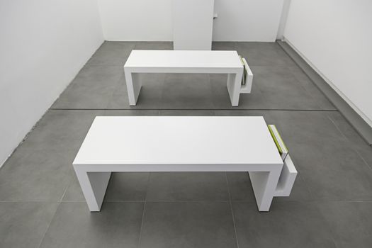 White benches museum, detail of benches to rest, relax