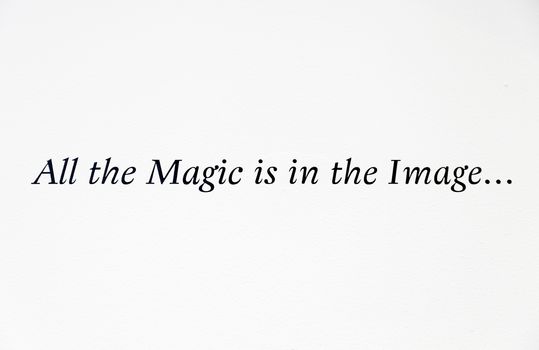 Text on a wall, detail of a written text, all the magic is in the image