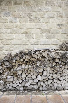 Firewood cut into a house, detail of a mountain of wood to burn and heat the house, traditional heating