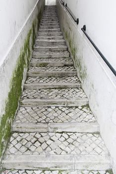 Old stairs in Lisbon, detail of a historic stairs and antique monument in the city, tourism in Portugal