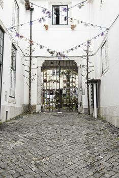 Old and historic alley in Lisbon, detail of an old street in the historical district, tourism in Portugal