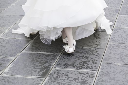 White bridal shoes at a wedding, detail of shoes for a wedding ceremony, love and fashion
