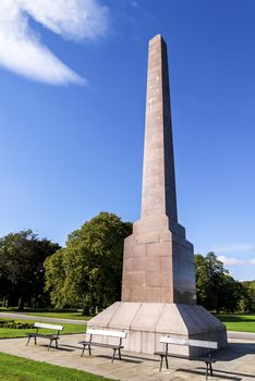 A few benches in front of remarkable McGrigor obelisk in Duthie park, Aberdeen, Scotland