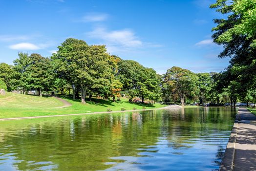 A long pond and an alley in Duthie park near the entrance, Aberdeen, Scotland