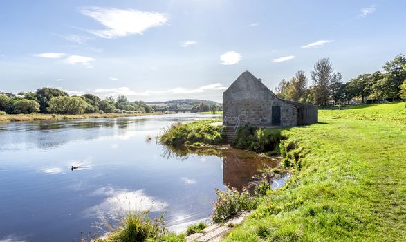 A view to river Dee shores and a bridge of Dee in a far background, Aberdeen, Scotland