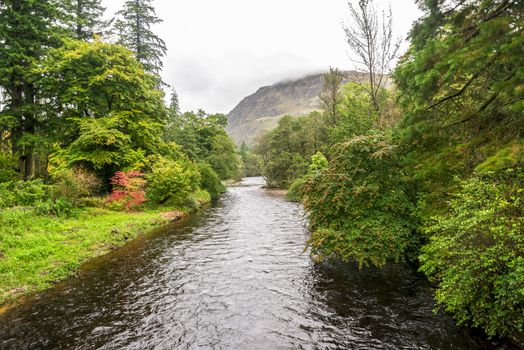 River Eachaig with a mountain on a background, Loch Lomond and the Trossachs National Park, Scotland