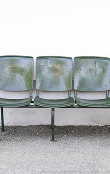 Ancient metal chairs, detail of a chair in the city, relax and rest