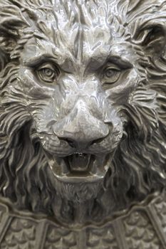 Lion head fountain, detail of a lion-shaped fountain, street art, monument