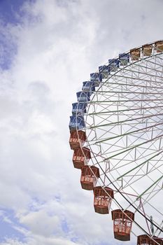 Detail of a ferris wheel, structure of an attraction at a fair in the city