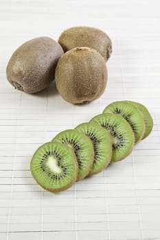 Kiwi tropical fruit detail bamboo background, detail of healthy living, feed