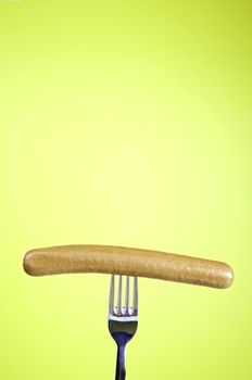 Sausage on fork frankfurter detail veal, meat food background