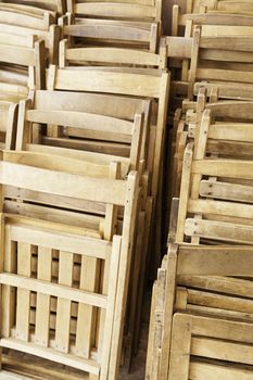 Old wooden chairs, detail of a closed wooden chairs, seating, rest and relaxation