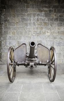 Old war cannon, detail of an ancient weapon of war and destruction, classic and historic