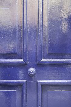 Old blue wooden door, detail of an old wooden door painted decoration and protection