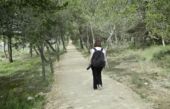 Pilgrim to Santiago, detail of young woman walking, pilgrim belief, sport