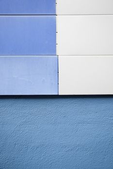 Blue wall building, detail of a wall in the city background with blue detail