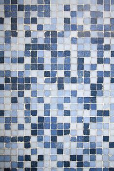 Blue Mosaic, detail of a wall decorated with blue tiles, textured background, modern