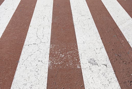 Zebra crossing red and white, detail of a pedestrian circulation signal, protection and security