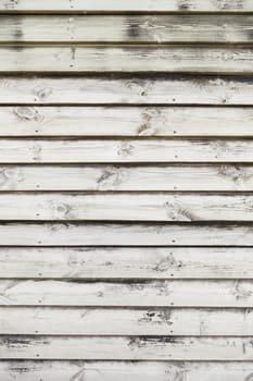 Wooden slats, detail of a wall decorated with wood in the city, wooden textured background