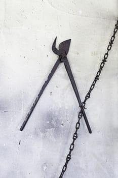 Ancient metal shears, detail of old tools in a foundry, industrial and manufacturing