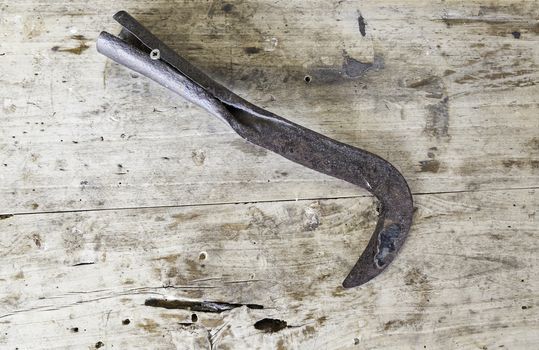 Old rusty scythe, detail of a classic tool to cut wheat and herbs