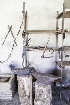 Anvils in an old blacksmith, detail of tools for shaping metal, traditional job