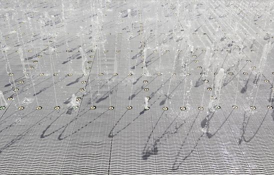 Fountain of water to play, detail of a water maze, summer games