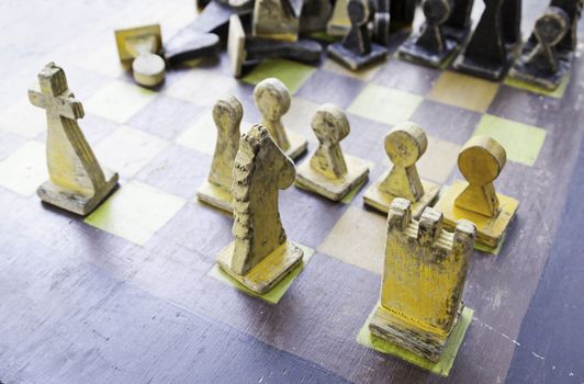 Artisan chess pieces, detail of a wooden chess handmade, tradition and play