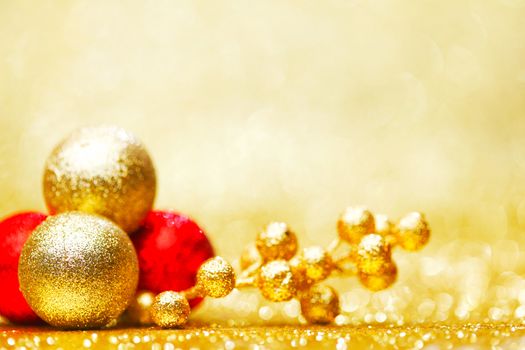 Colorful christmas decoration on shiny golden background