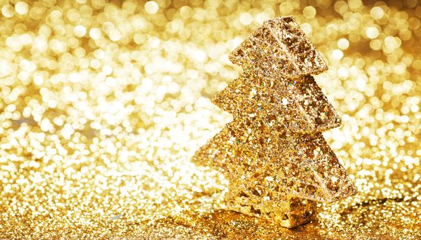 Decorative golden toy christmas tree and gifts