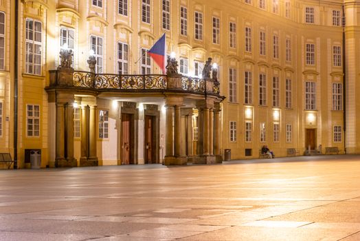 Entrance door with balcony to the Archives of Prague Castle on Third Courtyard by night, Prague, Czech Republic.