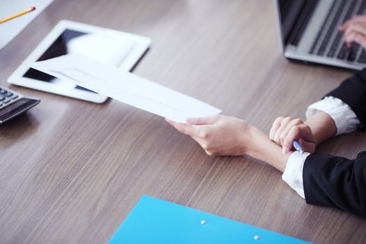 Close-up of Business people working together at meeting