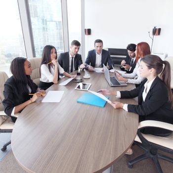 Business meeting of diverse people around the table