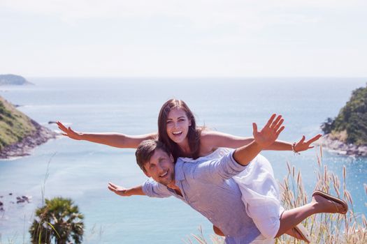 Happy smiling couple on vacation flying together